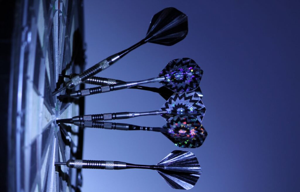 A selection of darts on a dart board