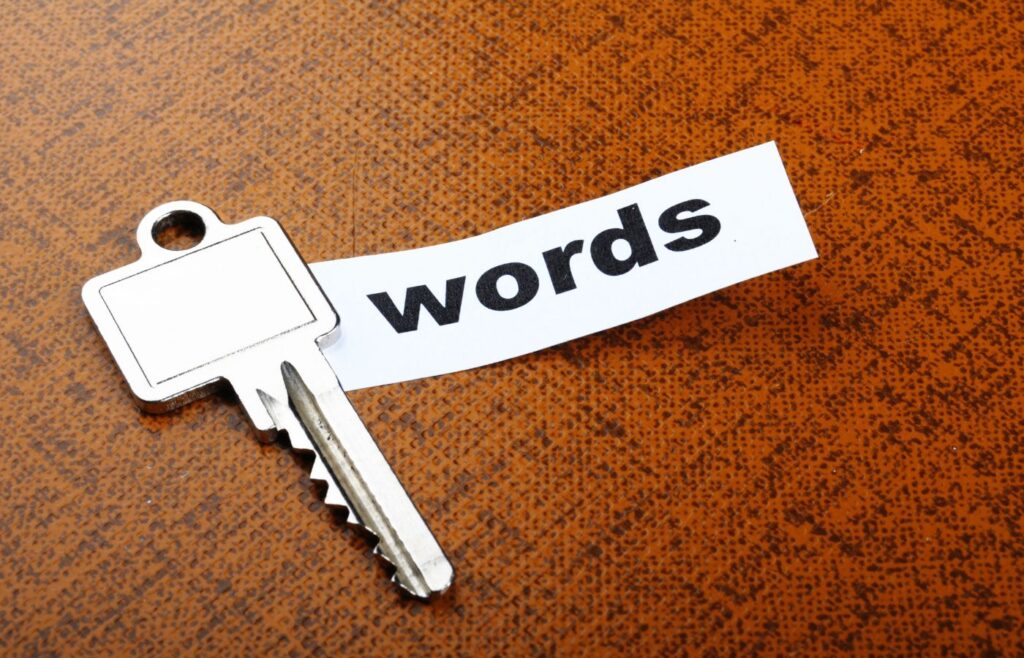 Shows a key with a print-out of the word 'words'