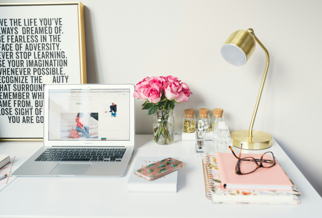 shows a white laptop on a desk - fashion digital marketing guide