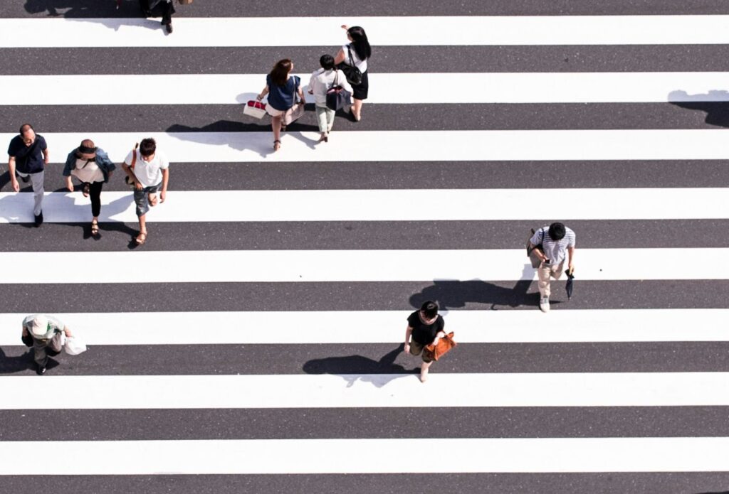shows people crossing a zebra crossing - ultimate guide to blogging