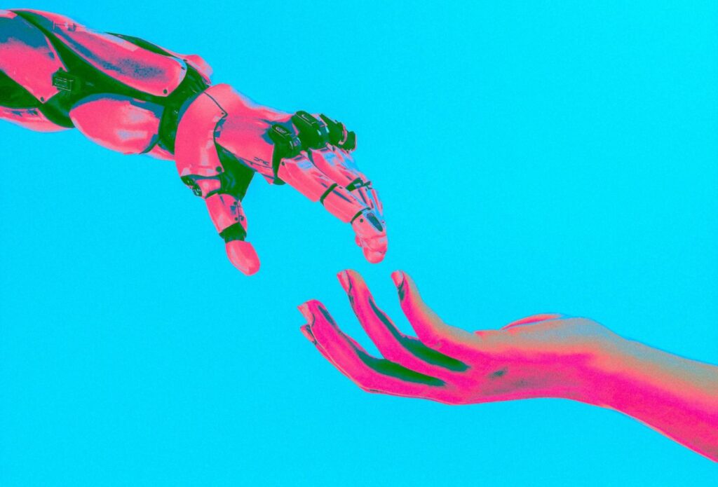 shows two pink and green painted hands on a blue background - Google's Experience Algorithm Update (March 2024)