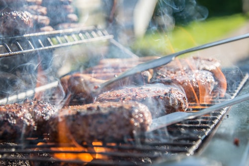 images shows meat on a bbq