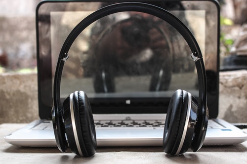 brand monitoring - shows an image of headphones and a laptop