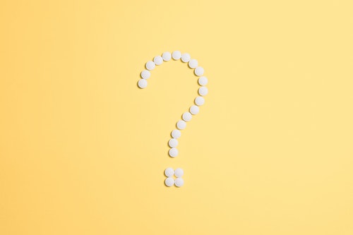shows an image of a white question mark on a yellow background