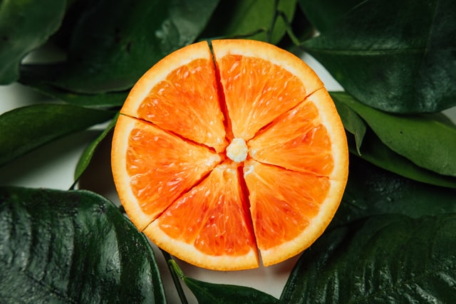 shows a close up image of a cut up orange