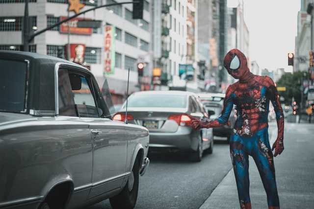 How to create a buyer persona - Shows Spiderman beside a car