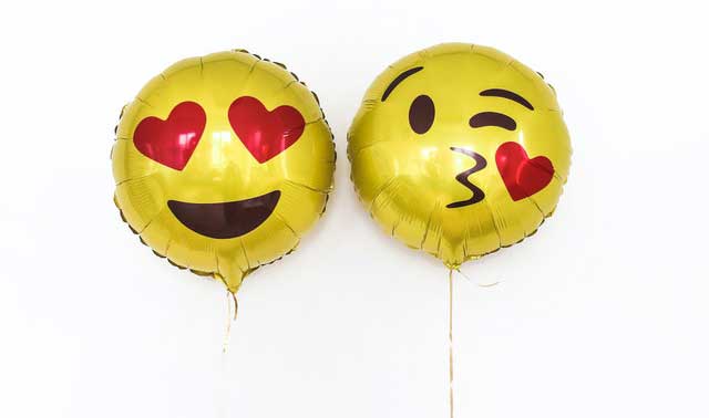 Shows two smiley face balloons