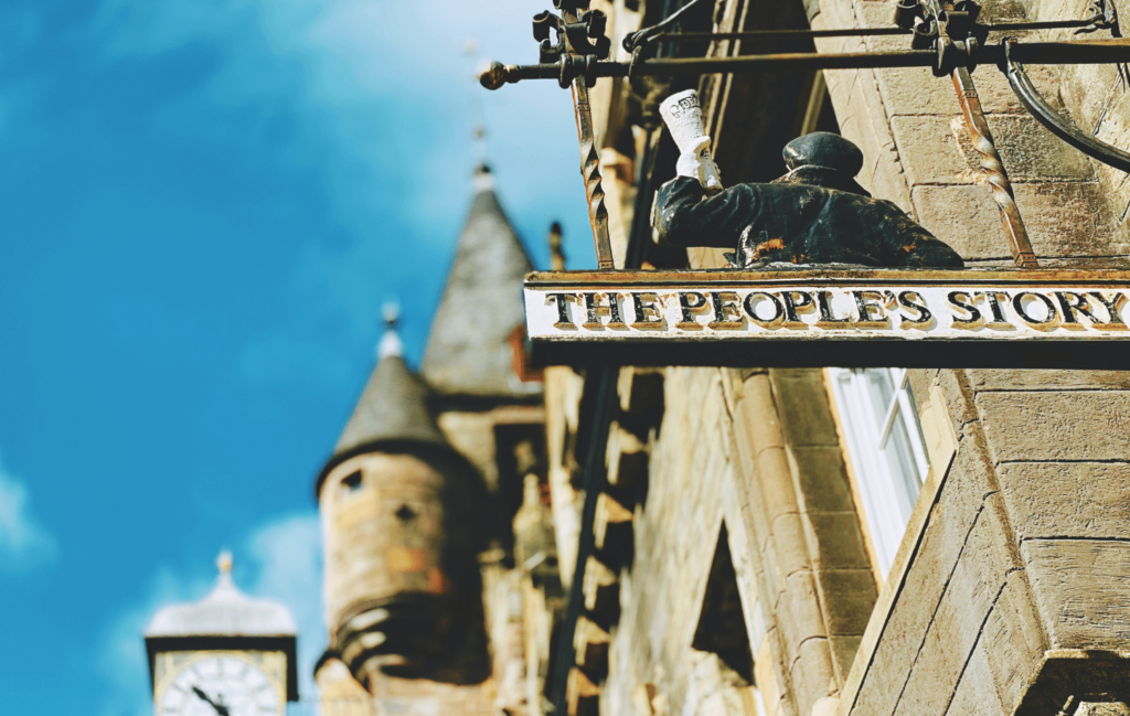 Old building in a city centre - Storytelling signpost