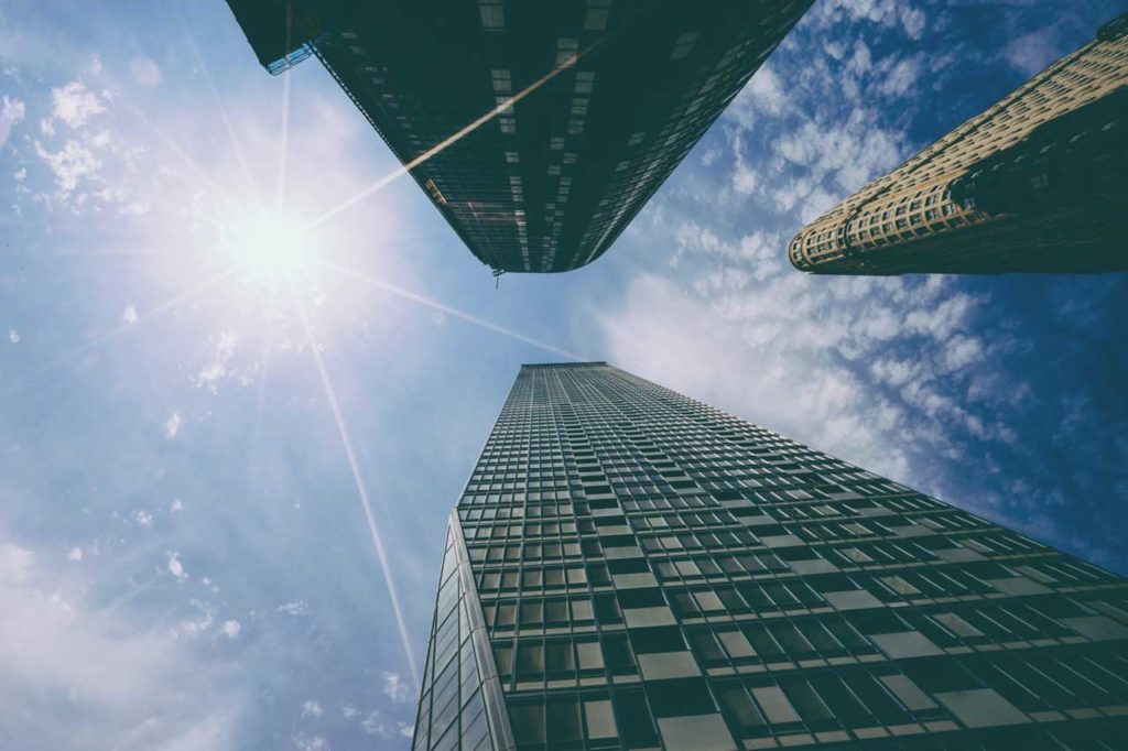 Level up your website copy - Shows skyscrapers from below