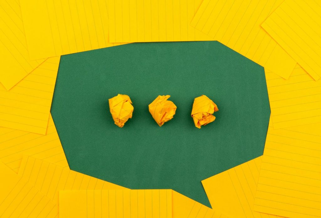 shows a yellow and green speech bubble made from tissue 