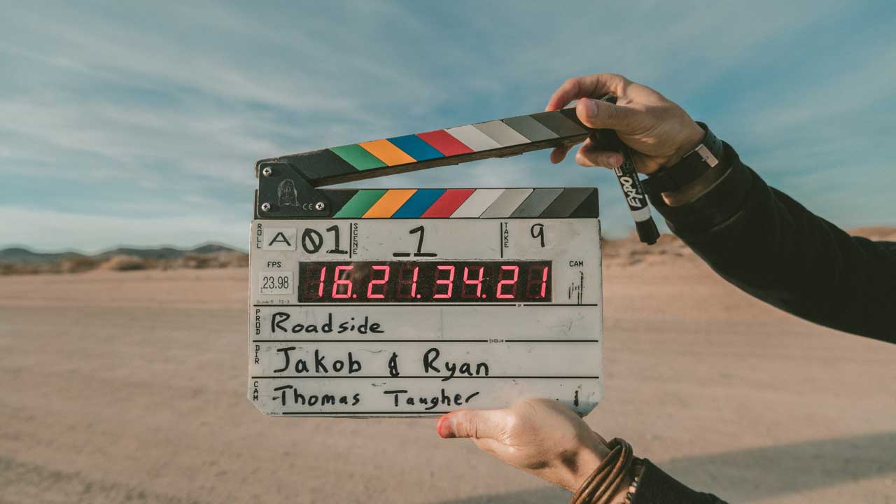 Blog post writing guide - Shows a director's clapper board