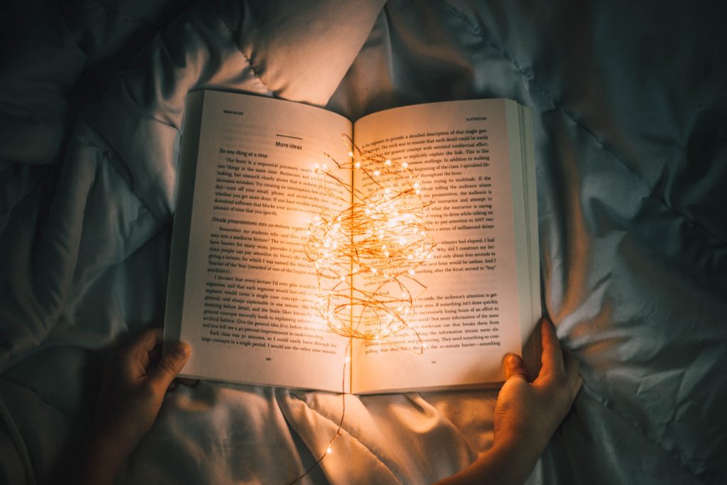 Shows an open book with lights - About page copywriting