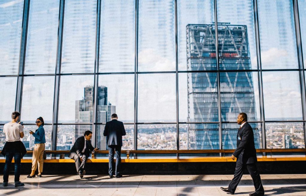 Corporate copywriting - Shows a group of businessmen in an office building