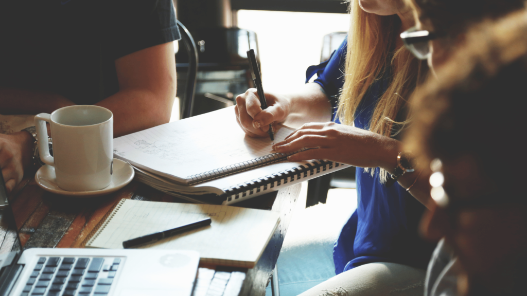 Essential copywriting skills - Shows a woman using a notepad