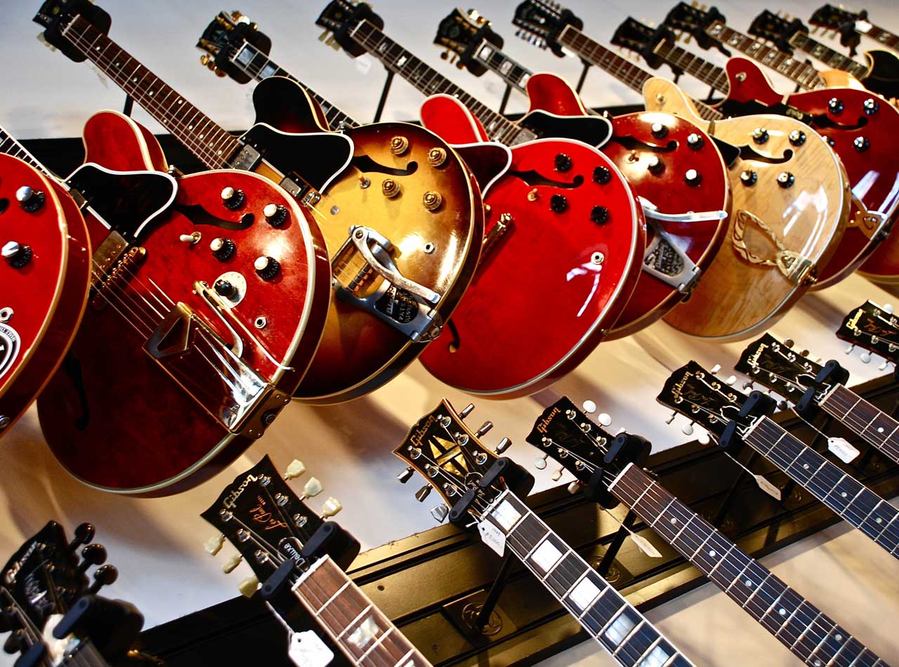 Music copywriter - Shows a selection of colourful guitars