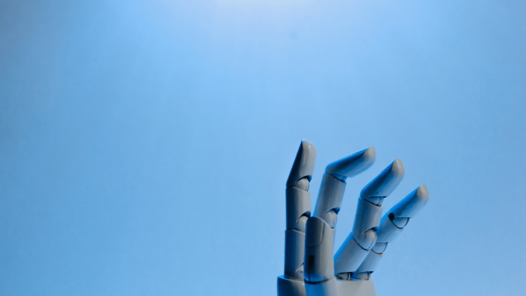 Shows a robotic hand on a blue background