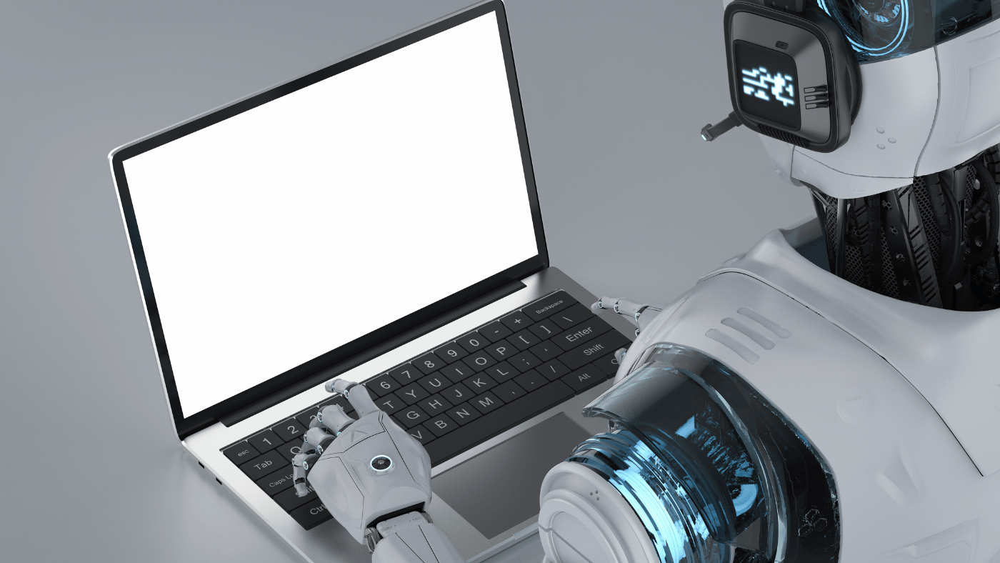Shows a robot operating a computer - AI article writing