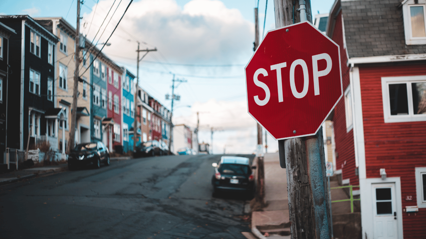 Copywriting for beginners - Shows a stop sign on a colourful street