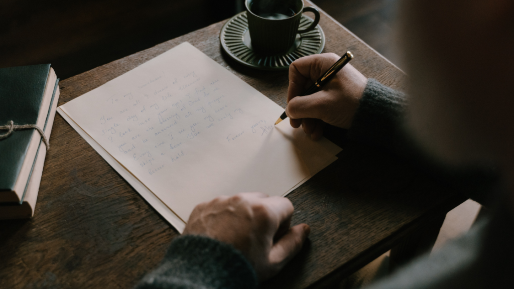 Writing a letter on a piece of paper