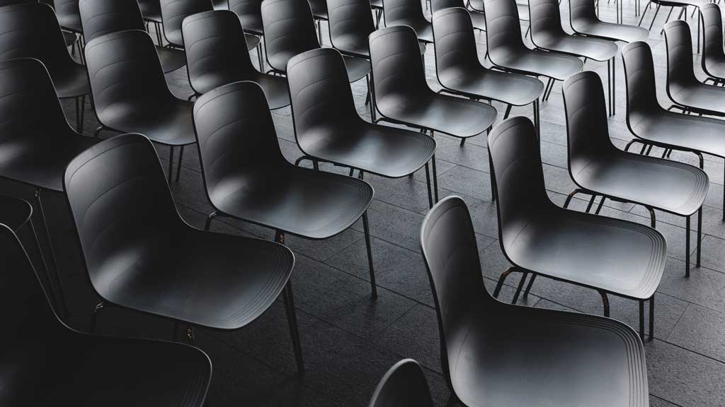 Shows rows of audience chairs