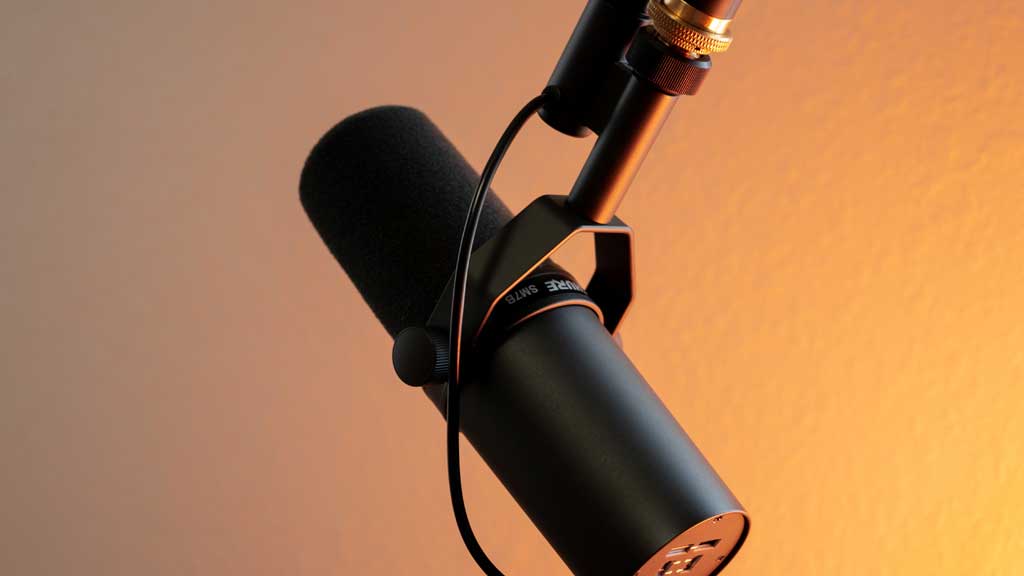 A podcast microphone on an orange background - Business to business copywriting examples