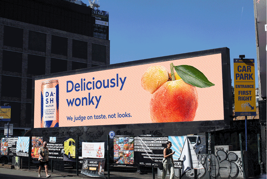 shows a billboard of a can of drink and a peach