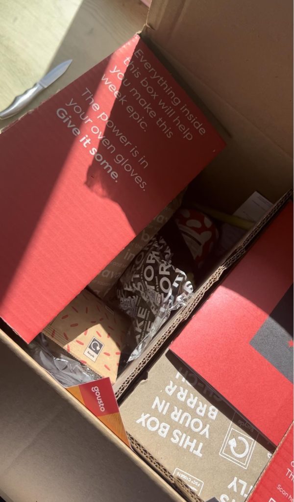 shows a cardboard box with white text - food description examples