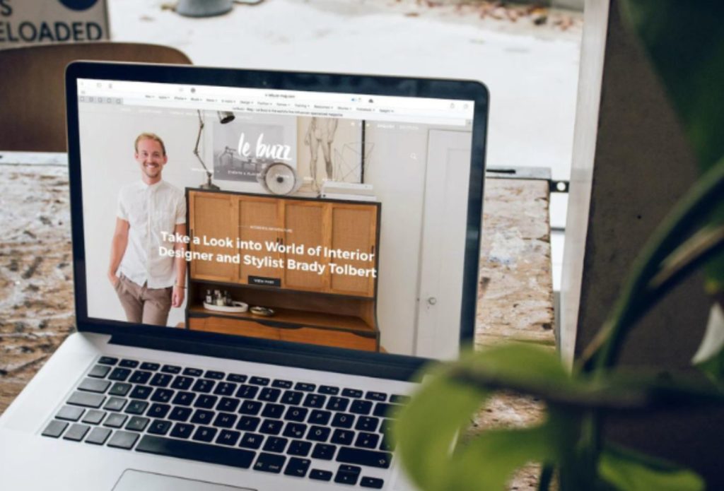 shows a mac book on a marble table 