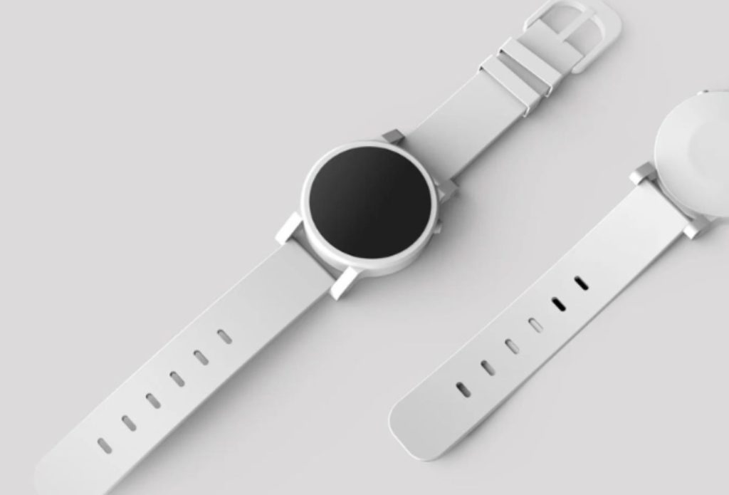 shows a white watch on a white table