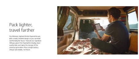 shows a man in a campervan on his kindle