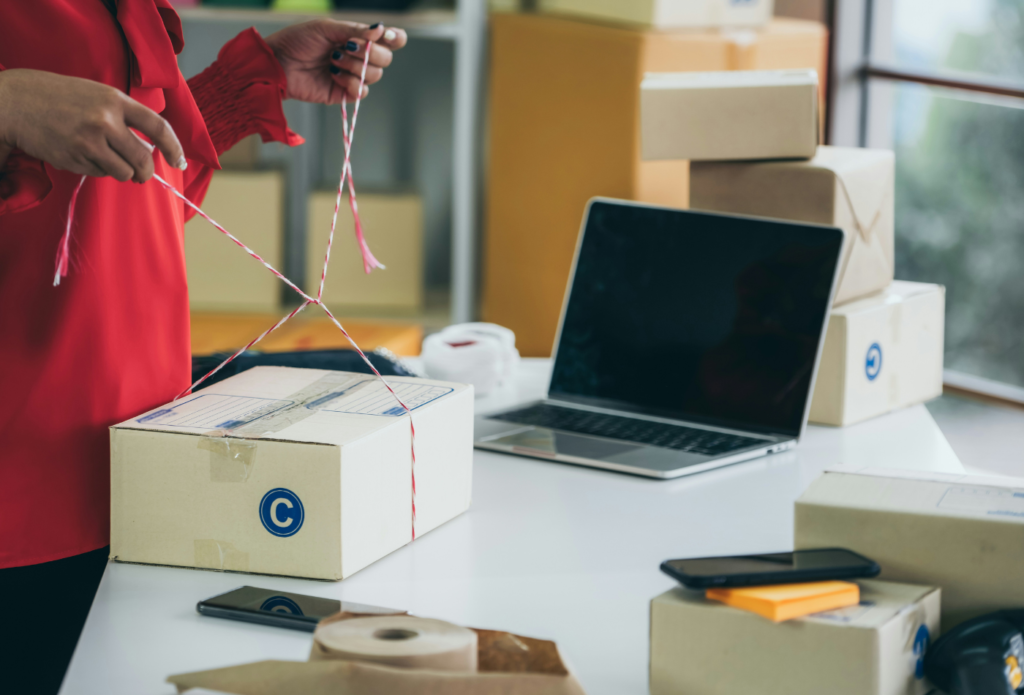 shows a box on a desk next to a laptop