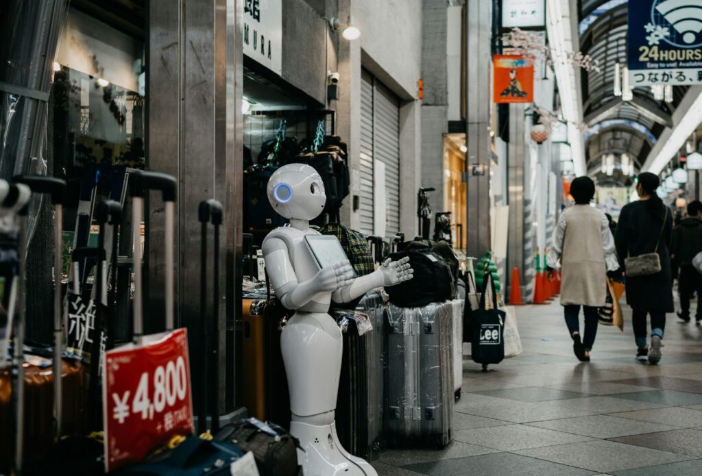 shows a white robot at a luggage store