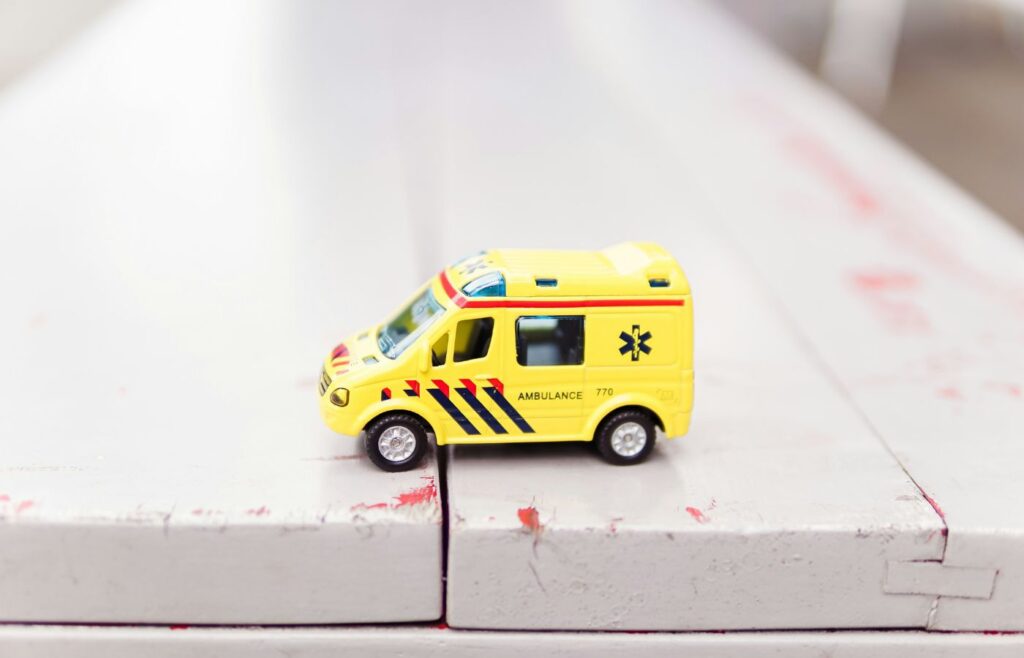insurance content marketing guide - shows a toy ambulance on a table 