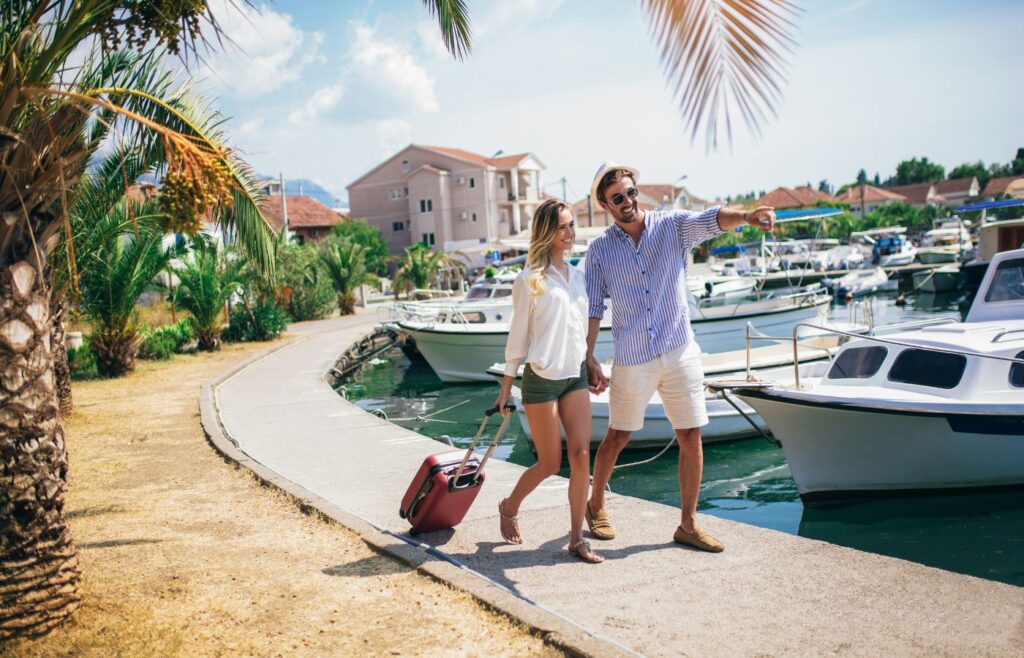 shows a couple walking along the marina