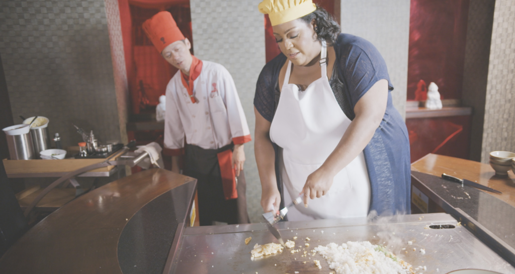 shows two people cooking