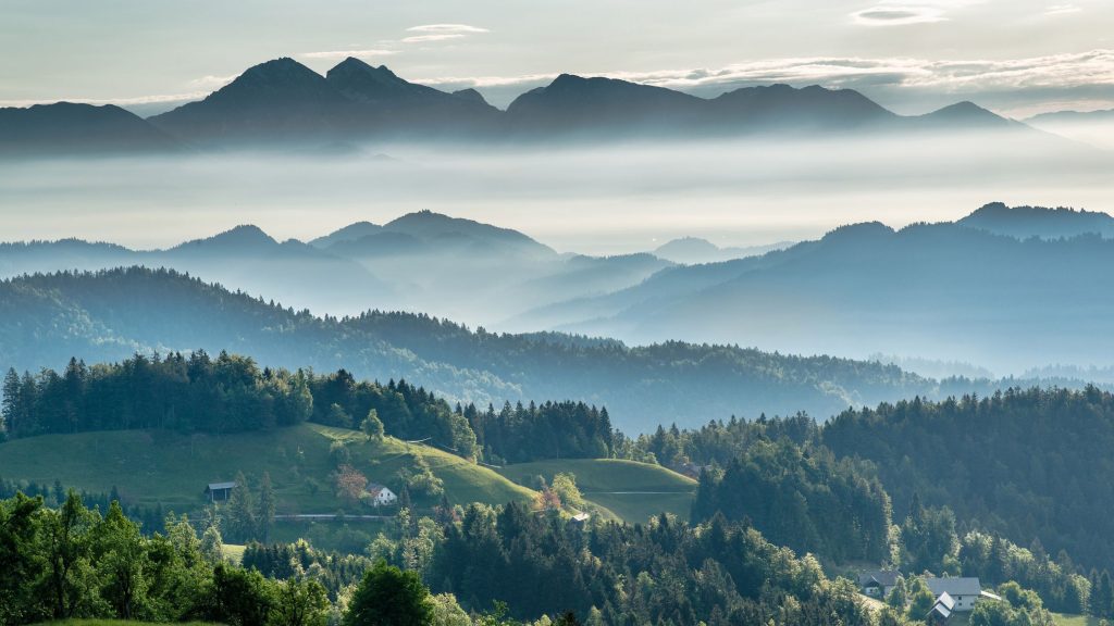 Shows a calm and scenic photo of the mountains