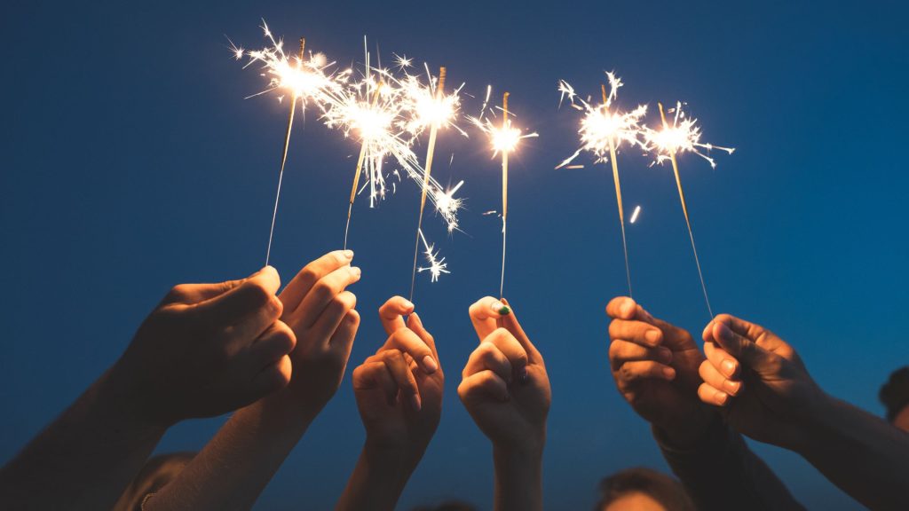 Shows people holding sparks