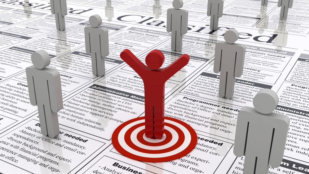 Shows an animation of grey men and one red man 